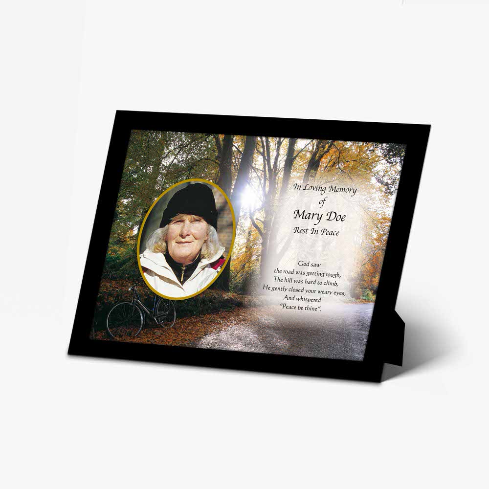 a memorial photo frame with a picture of a woman in a hat