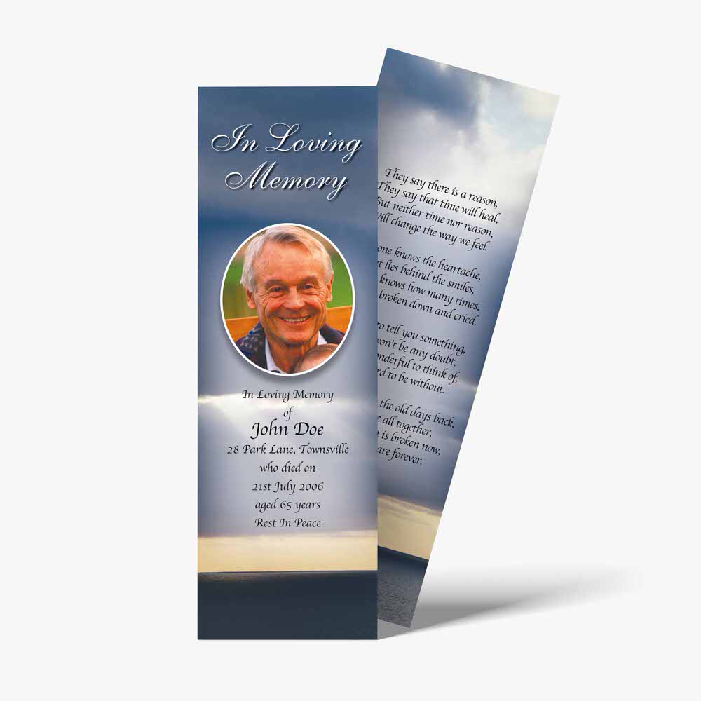 a funeral bookmark with a photo of a man in the sky