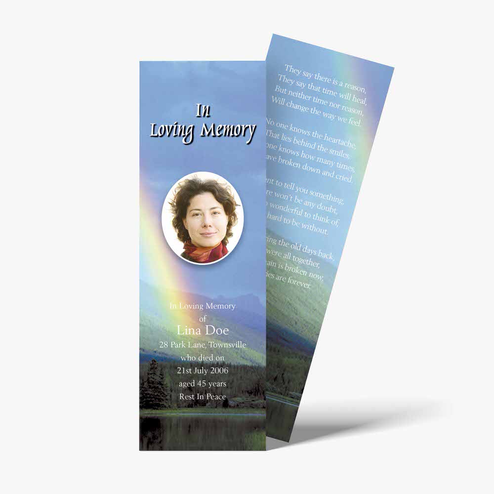 a funeral bookmark with a rainbow in the sky