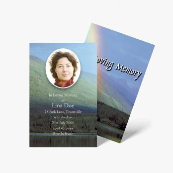 a funeral card with a photo of a woman in a forest