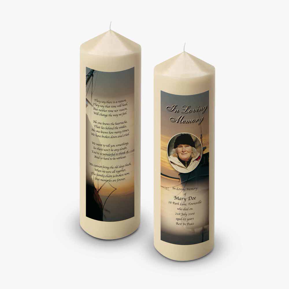 two candles with a photo of a man on them