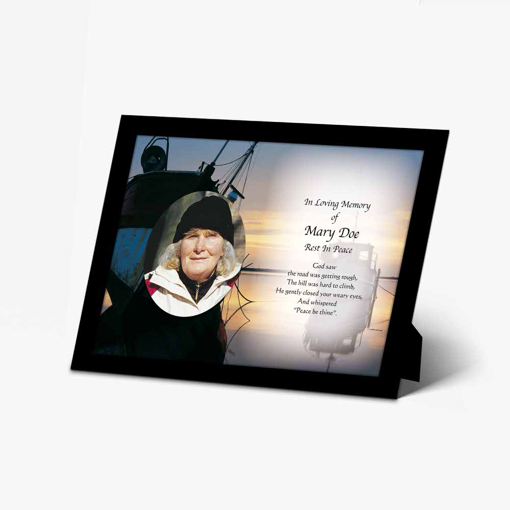 a memorial photo frame with a picture of a woman on a boat