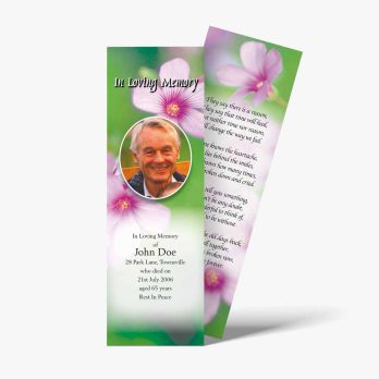 a funeral bookmark with a photo of a man and flowers