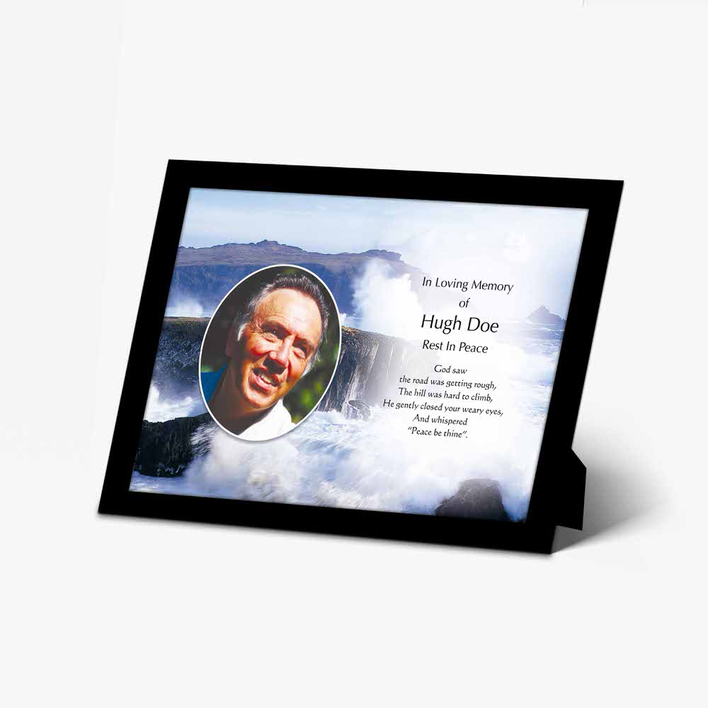 a memorial photo frame with a photo of a man in a black and white photo frame