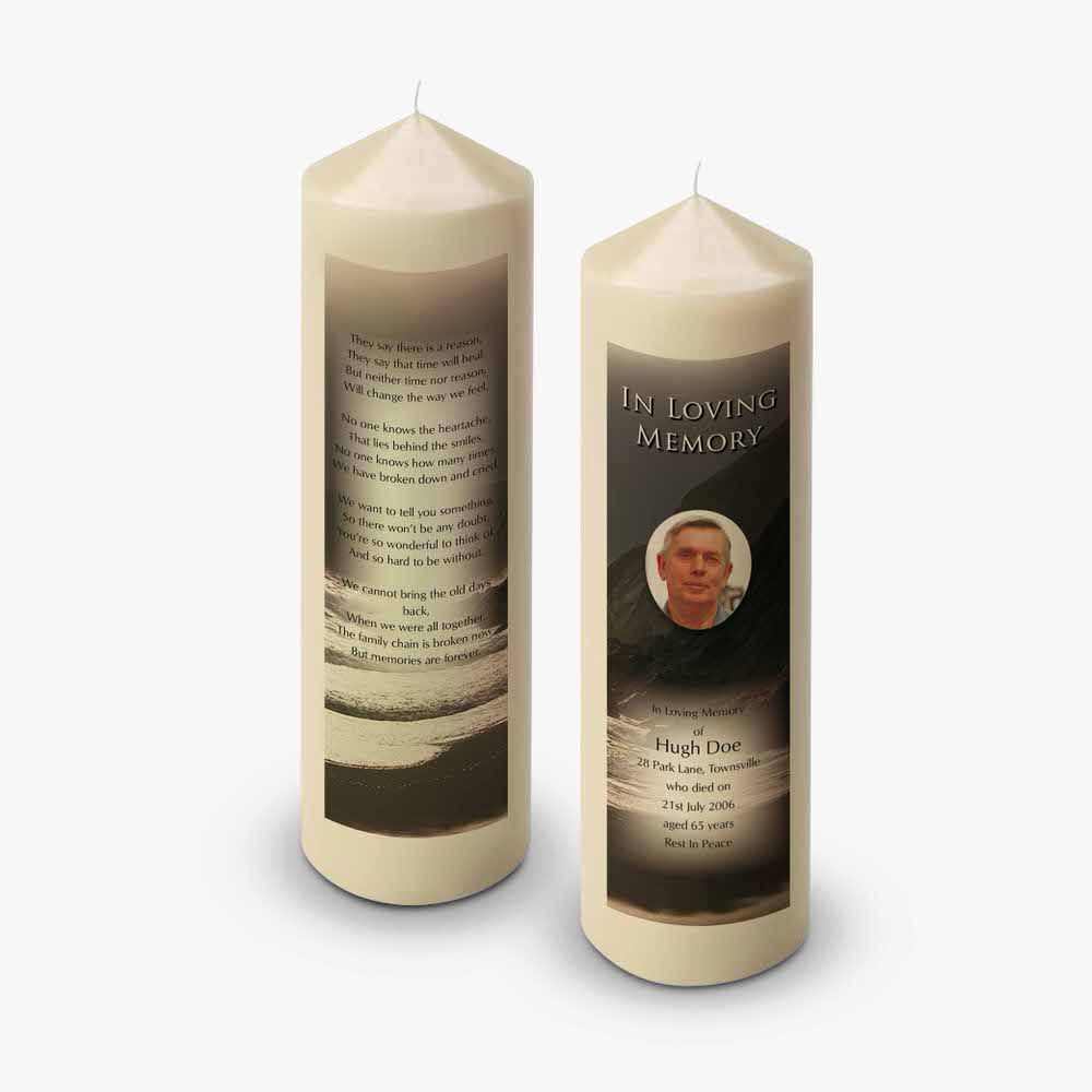 two candles with a photo of a man on them