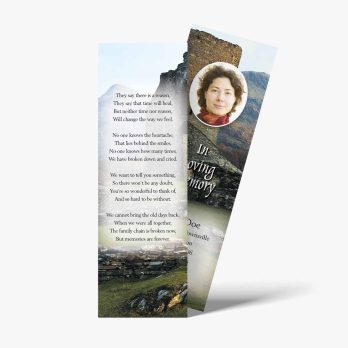 a bookmarks with a photo of a woman in the mountains