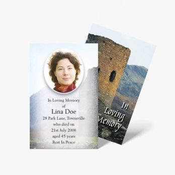 a funeral card with a photo of a woman in front of a castle