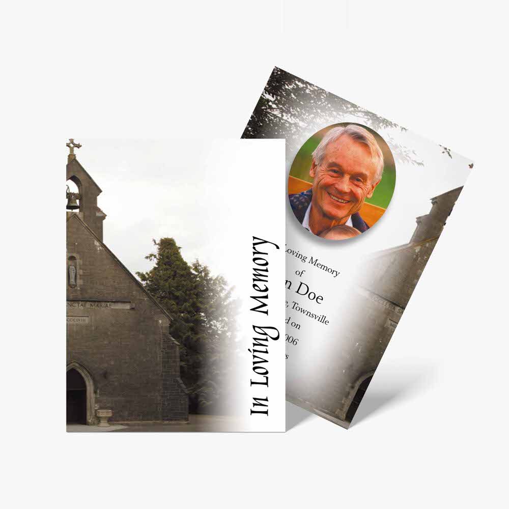 a funeral card with a church in the background