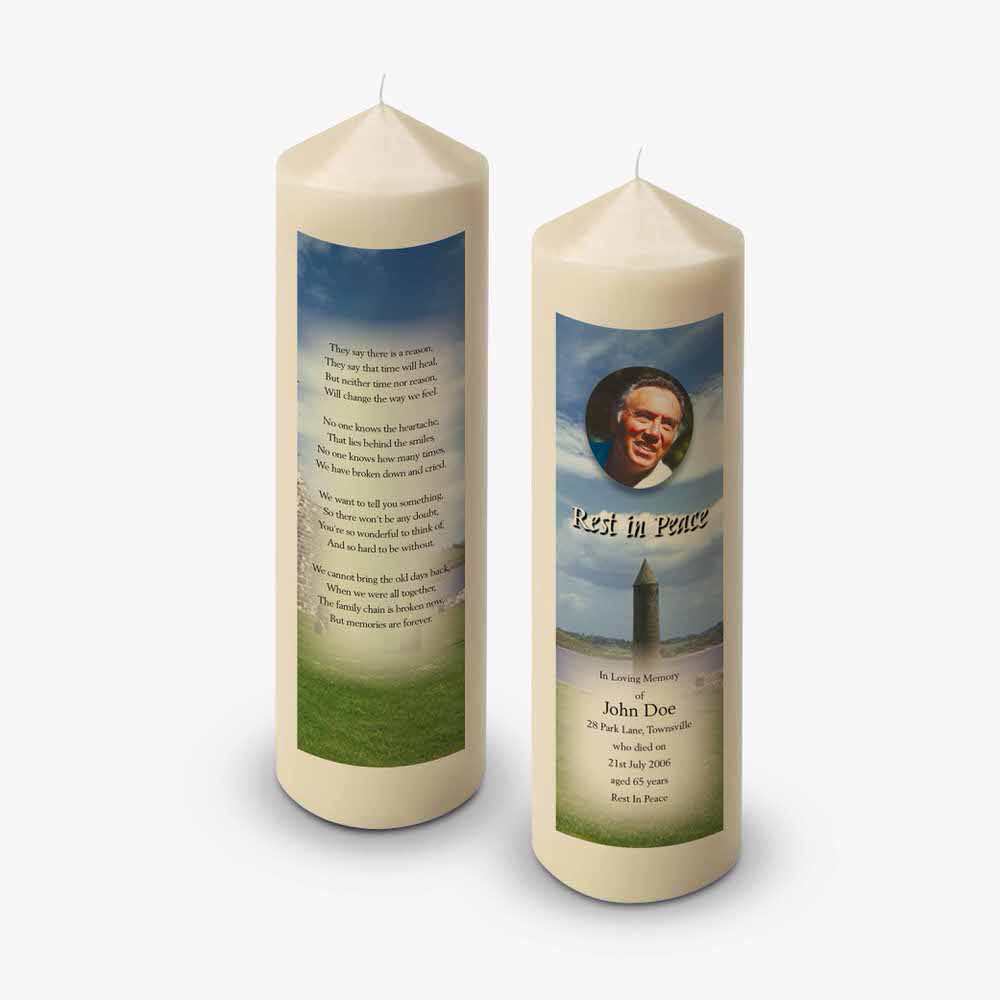 two candles with a picture of a man on them