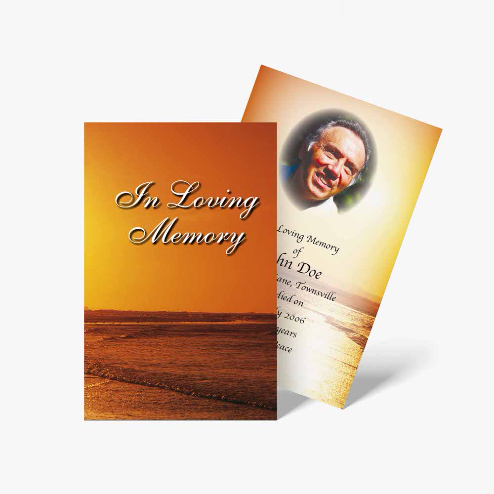 a funeral card with a sunset in the background