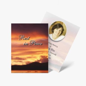 a funeral card with a sunset in the background