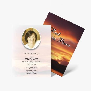 a funeral card with a photo of a sunset and a quote