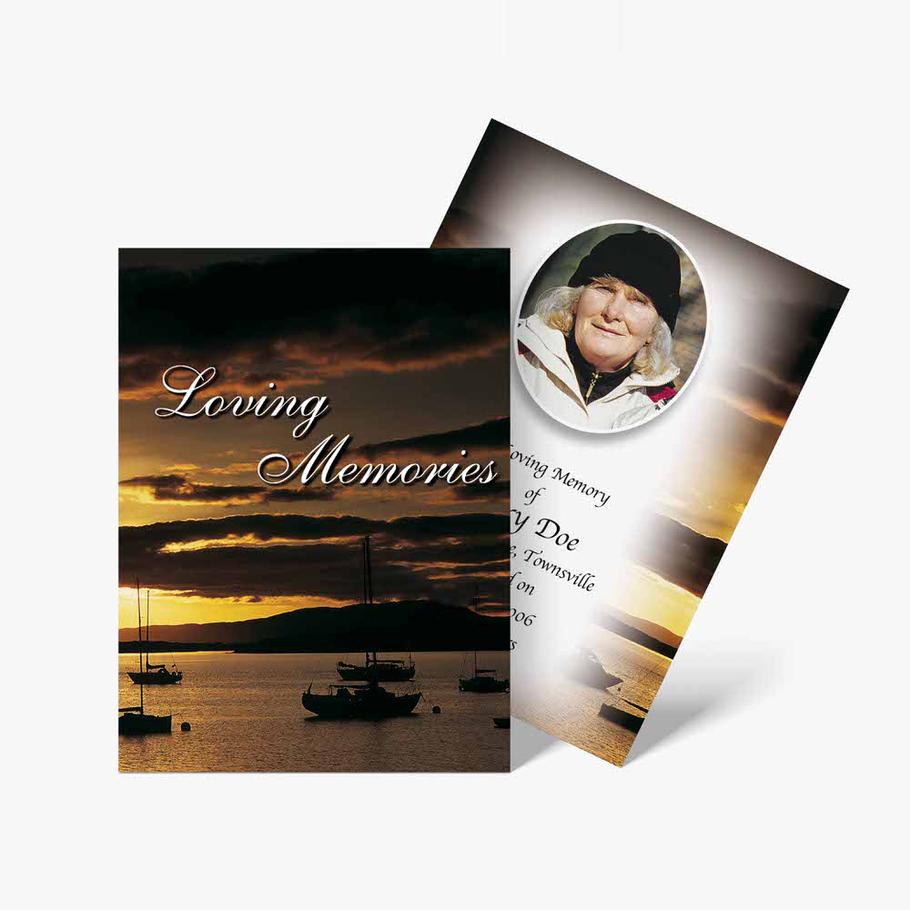 a funeral card with a photo of a boat and sunset