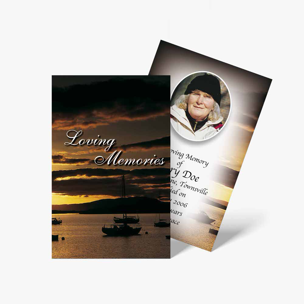 a funeral card with a photo of a boat on the water