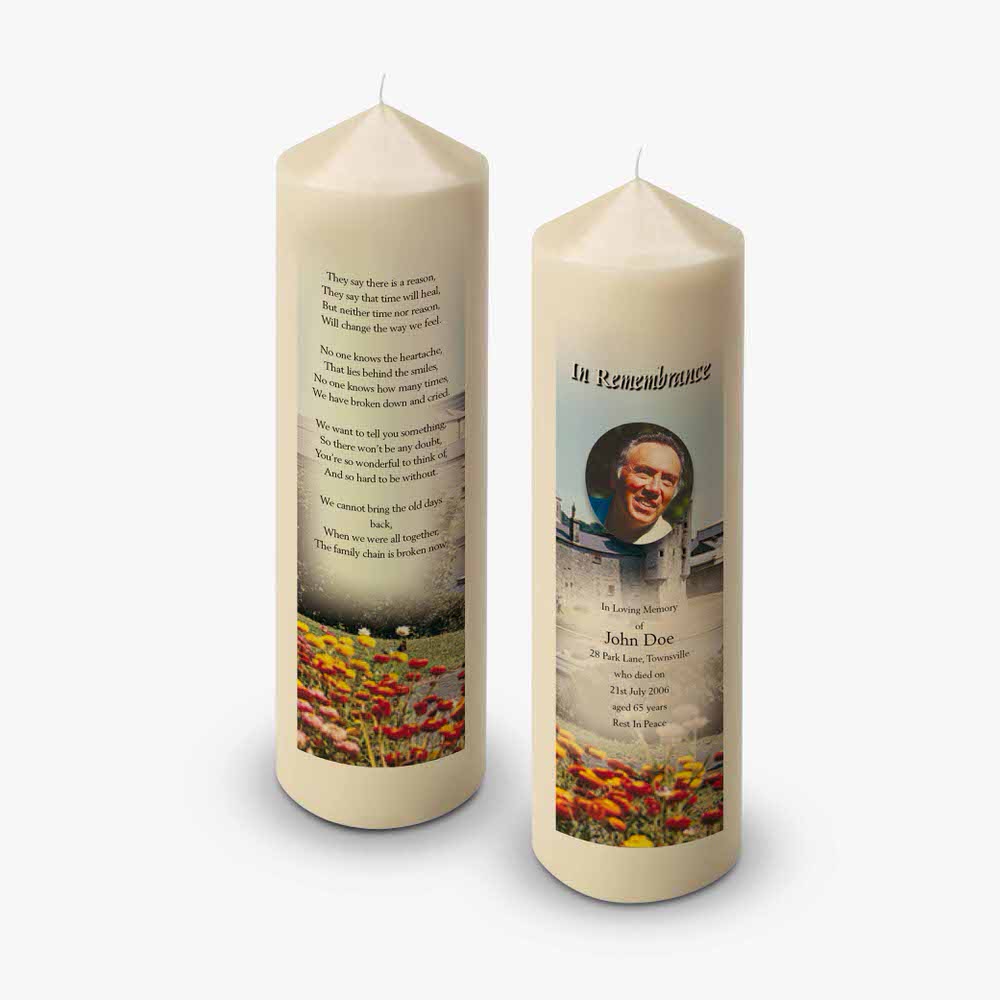two candles with a photo of a man and a woman