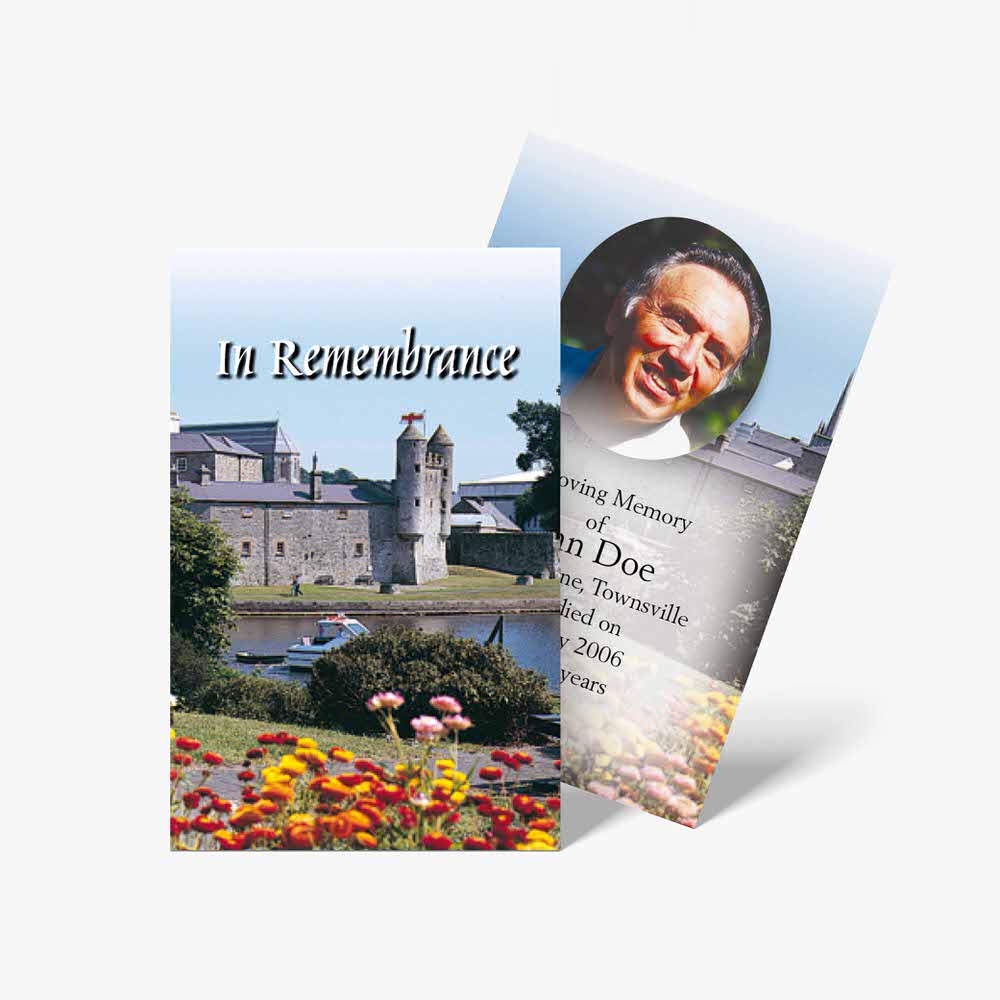 a memorial card with a photo of a castle and flowers