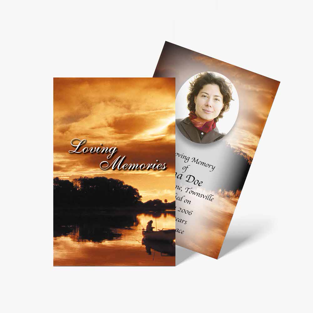 a funeral card with a sunset in the background