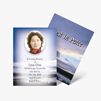 a funeral card with a photo of a woman in the sky