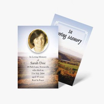 a funeral card with a photo of a woman in the mountains