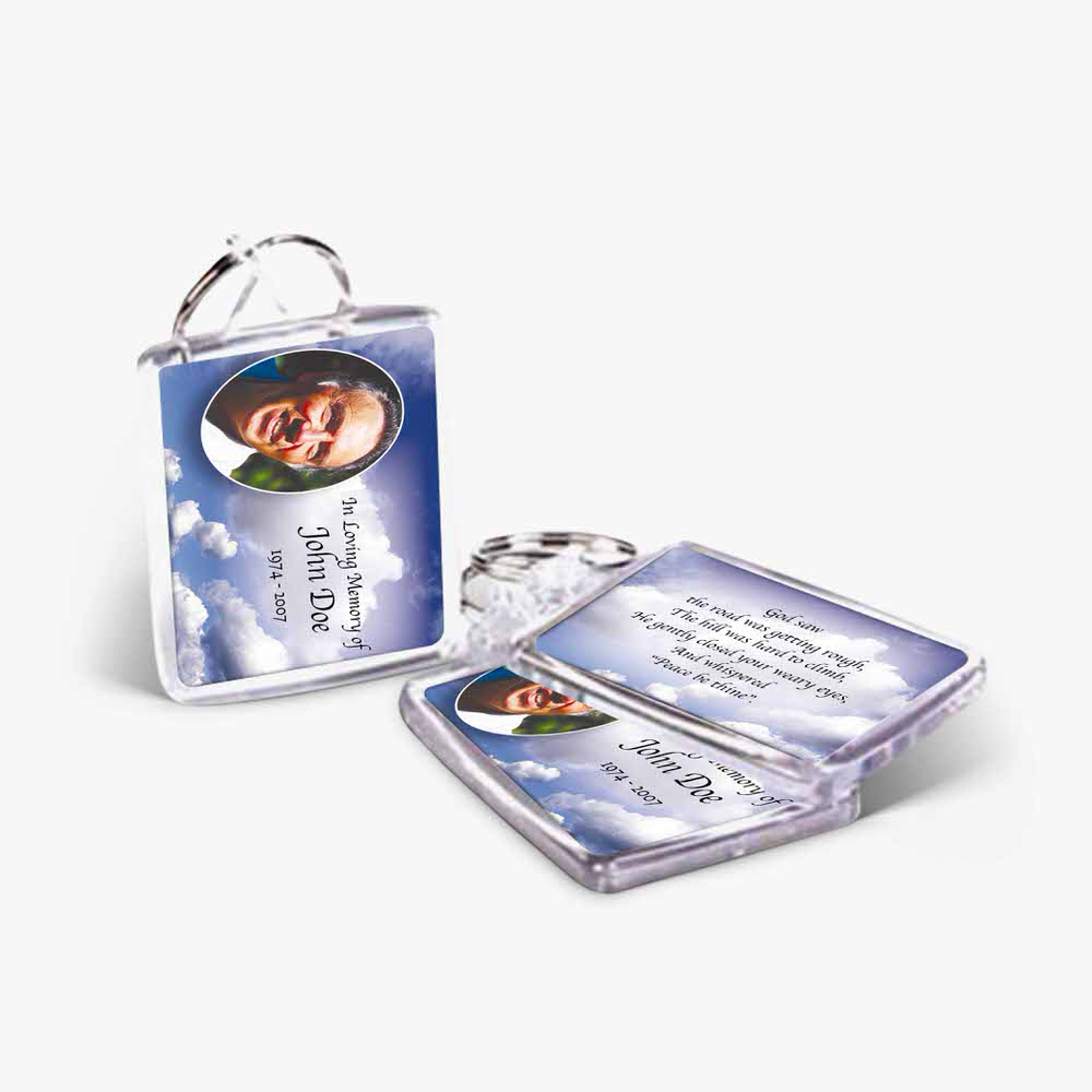 a photo card and a key chain with a picture of a person