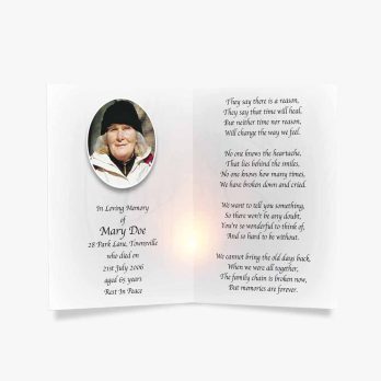 a candle lighted memorial card