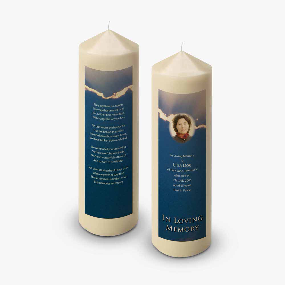 a candle with a poem on it and a picture of a person