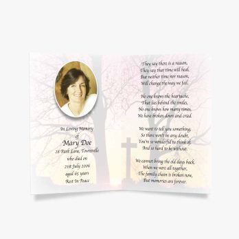 a funeral prayer card with a photo of a woman in a tree