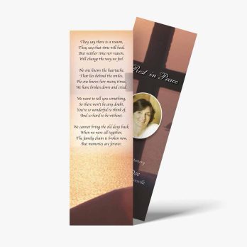 a bookmark with a photo of a person and a cross