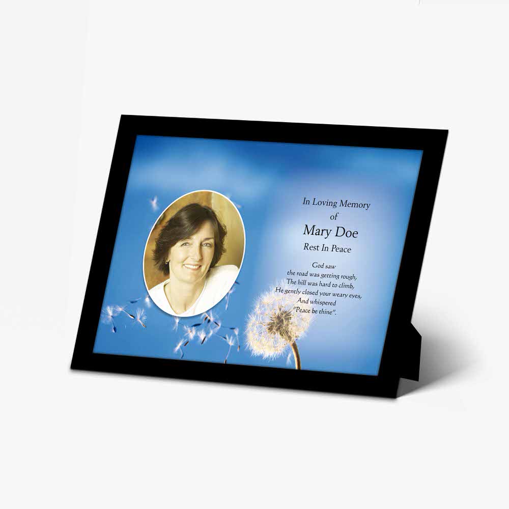 a memorial photo frame with a dandelion