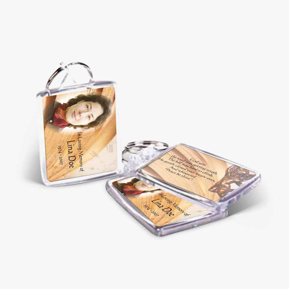 a photo card and a key chain with a photo of a woman