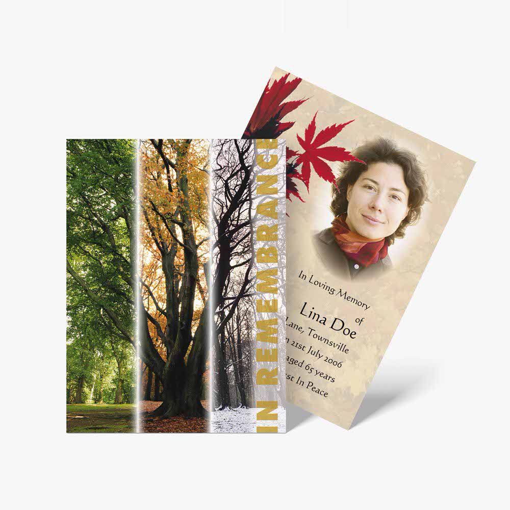 a memorial card with a tree and leaves