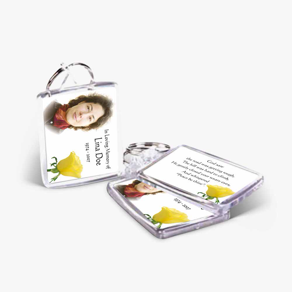 a yellow flower keychain with a photo of a woman