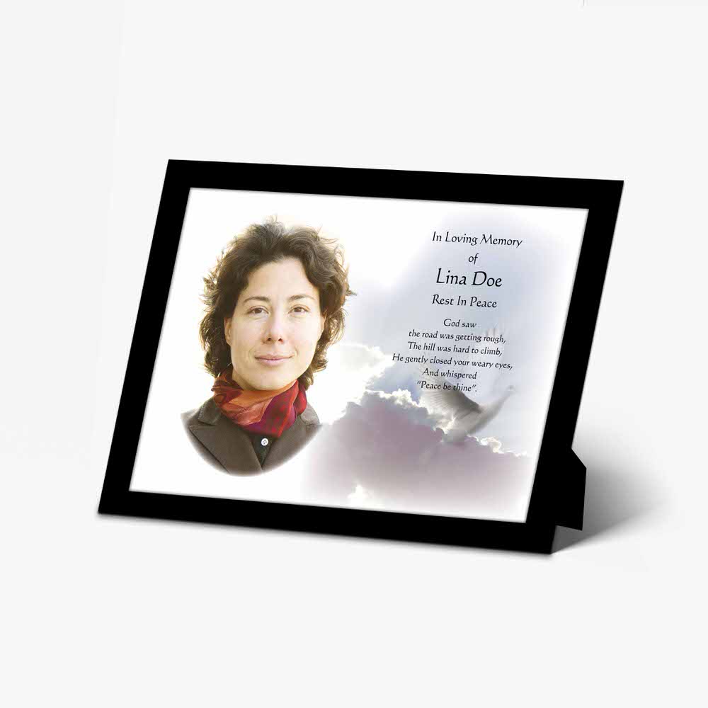 a memorial photo frame with a photo of a woman in a white dress