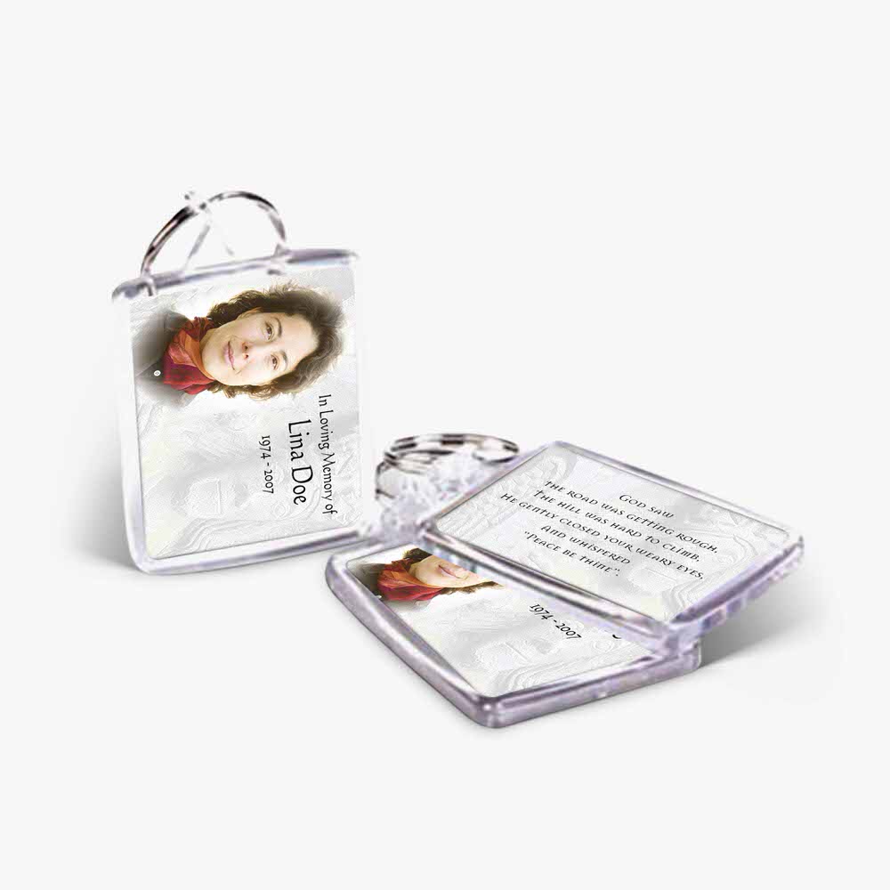 a small clear plastic keychain with a photo of a woman