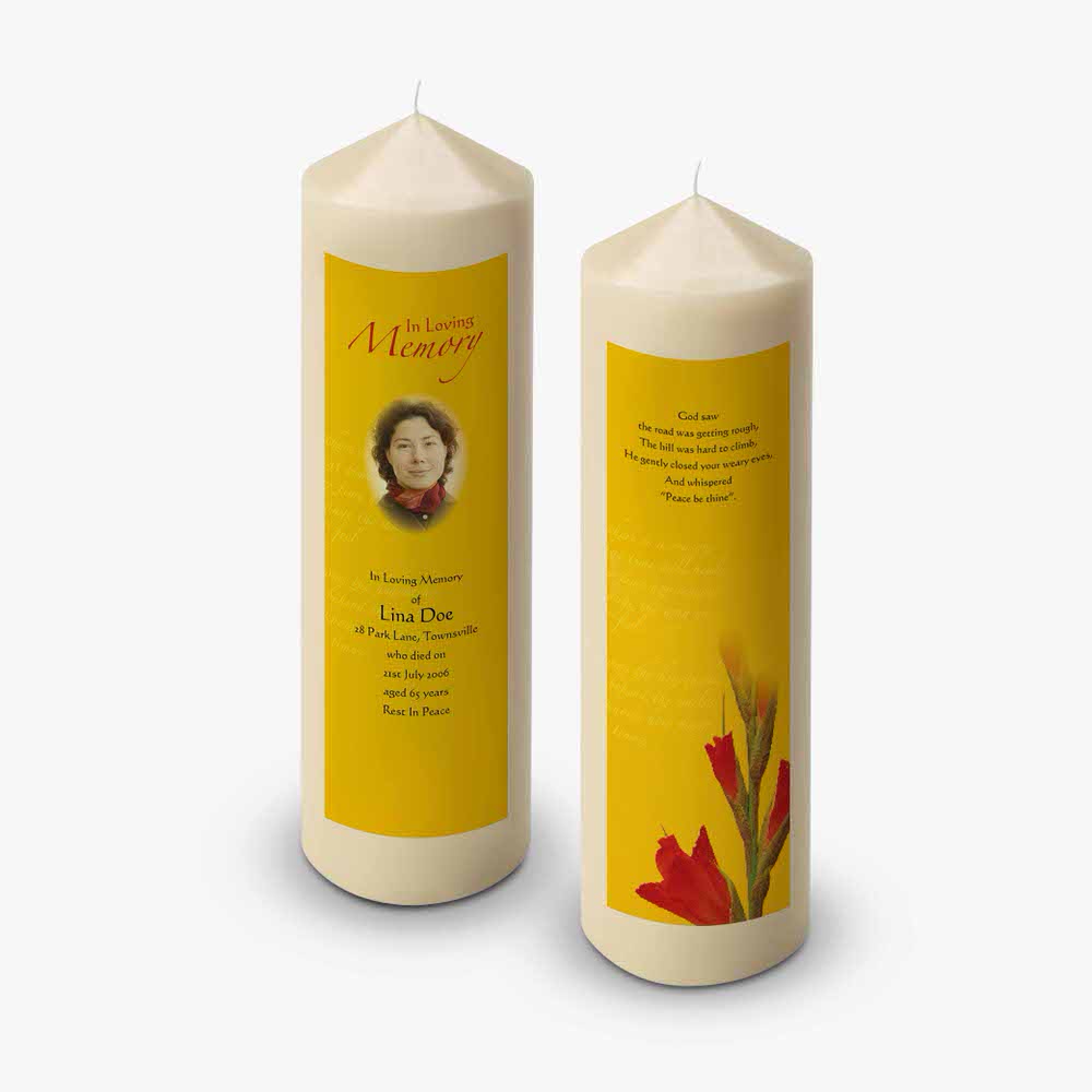 two yellow candles with a picture of a woman on them