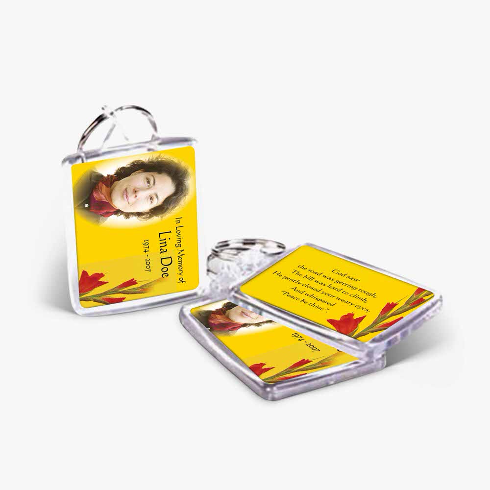 a yellow keychain with a photo of a woman