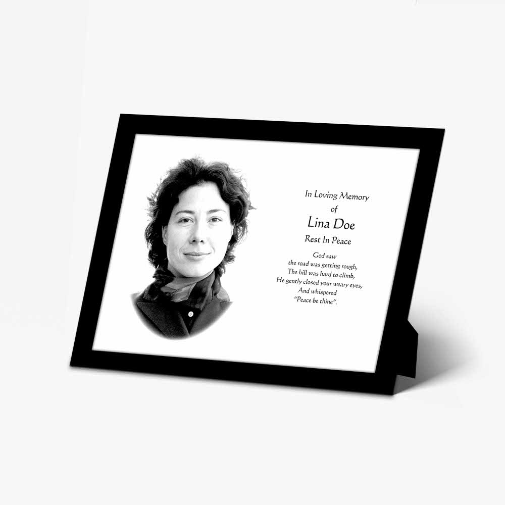 a memorial photo frame with a black and white photo of a woman
