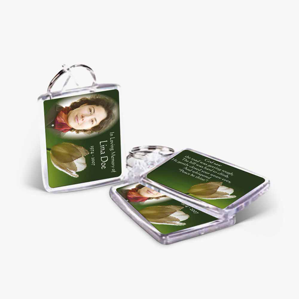 a key chain with a photo of a woman and a flower