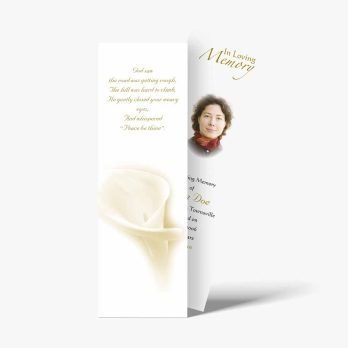 a funeral card with a white calla lily on it
