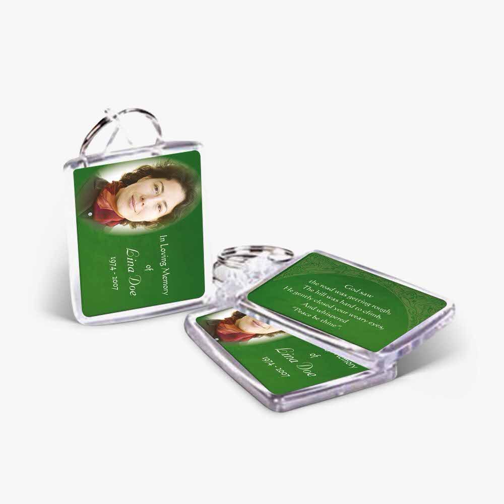 a green and white keychain with a photo of a woman