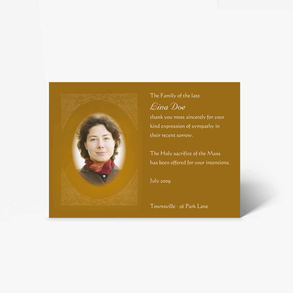 a beautiful funeral card with a photo of a woman in a gold frame