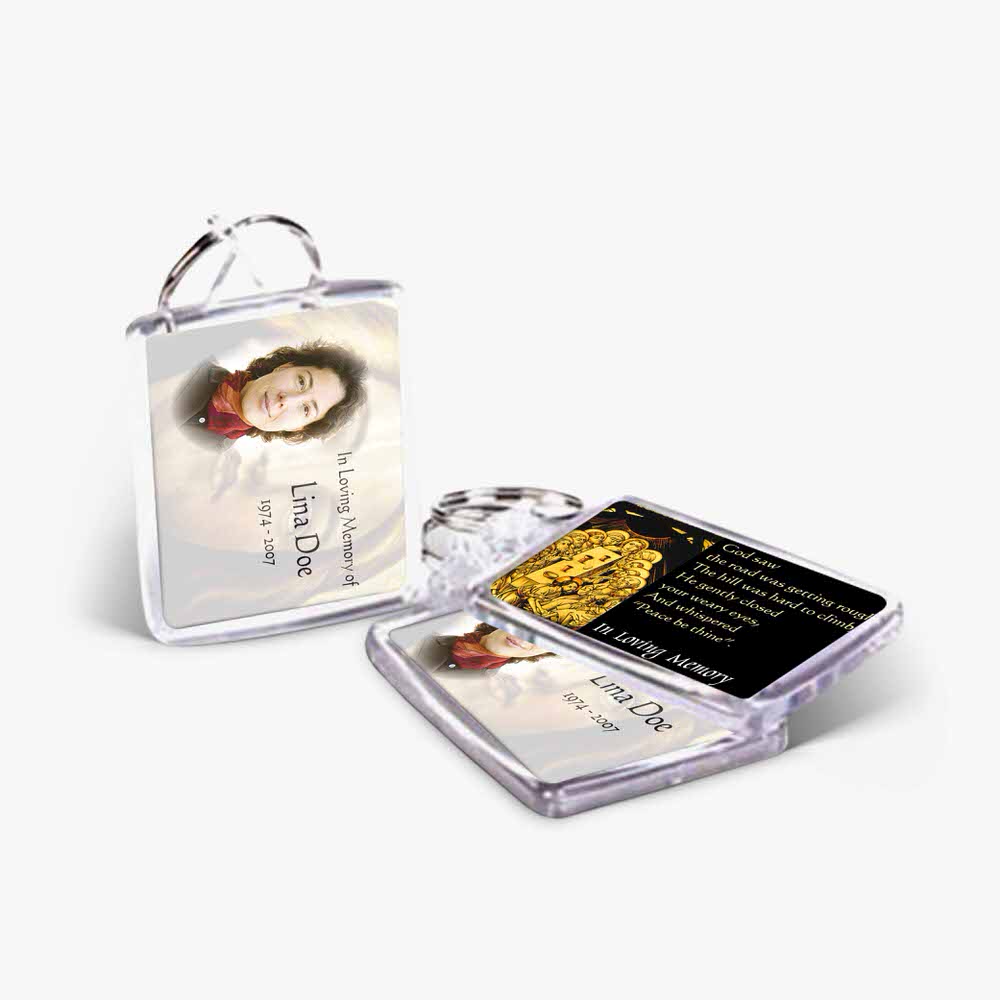a key chain with a photo of a woman and a gold coin