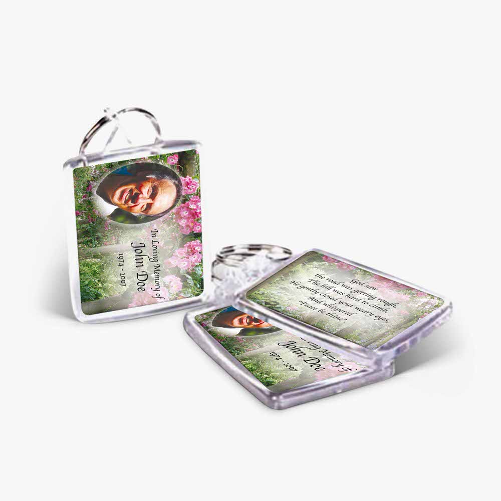 a keychain with a photo of a woman and flowers