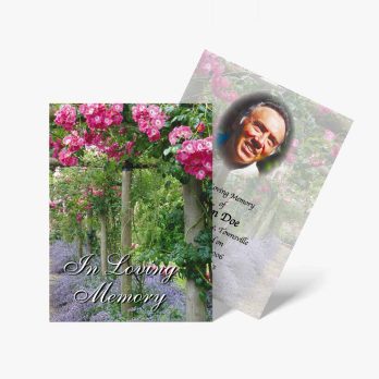 memorial cards with flowers and a photo of a man in a garden