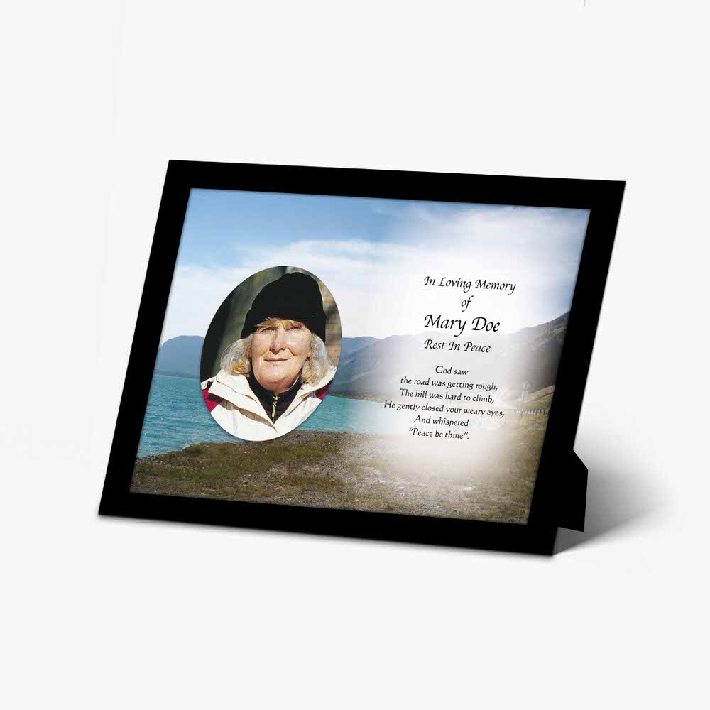 a memorial photo frame with a photo of a woman in a hat