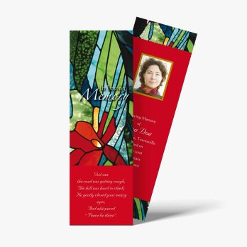 a bookmark with a red and green floral design