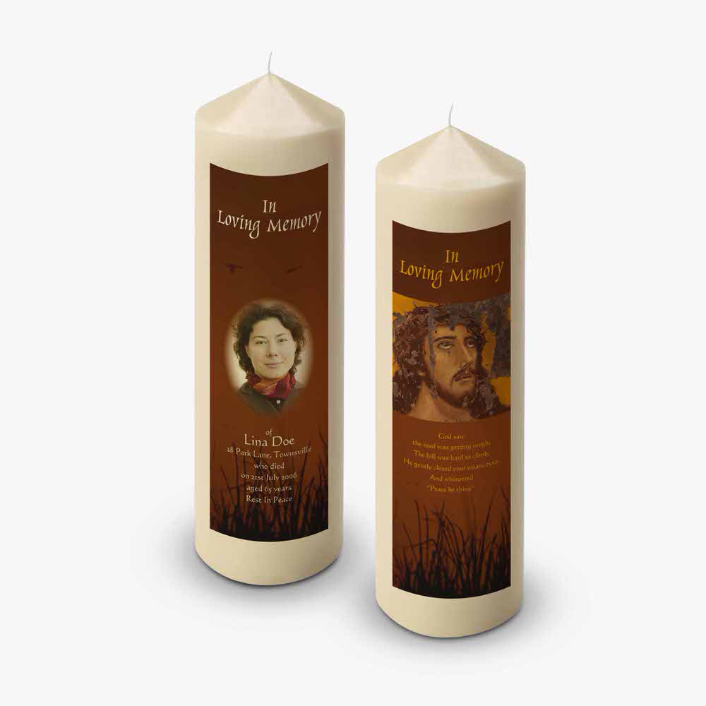 a candle with a picture of a man and woman on it