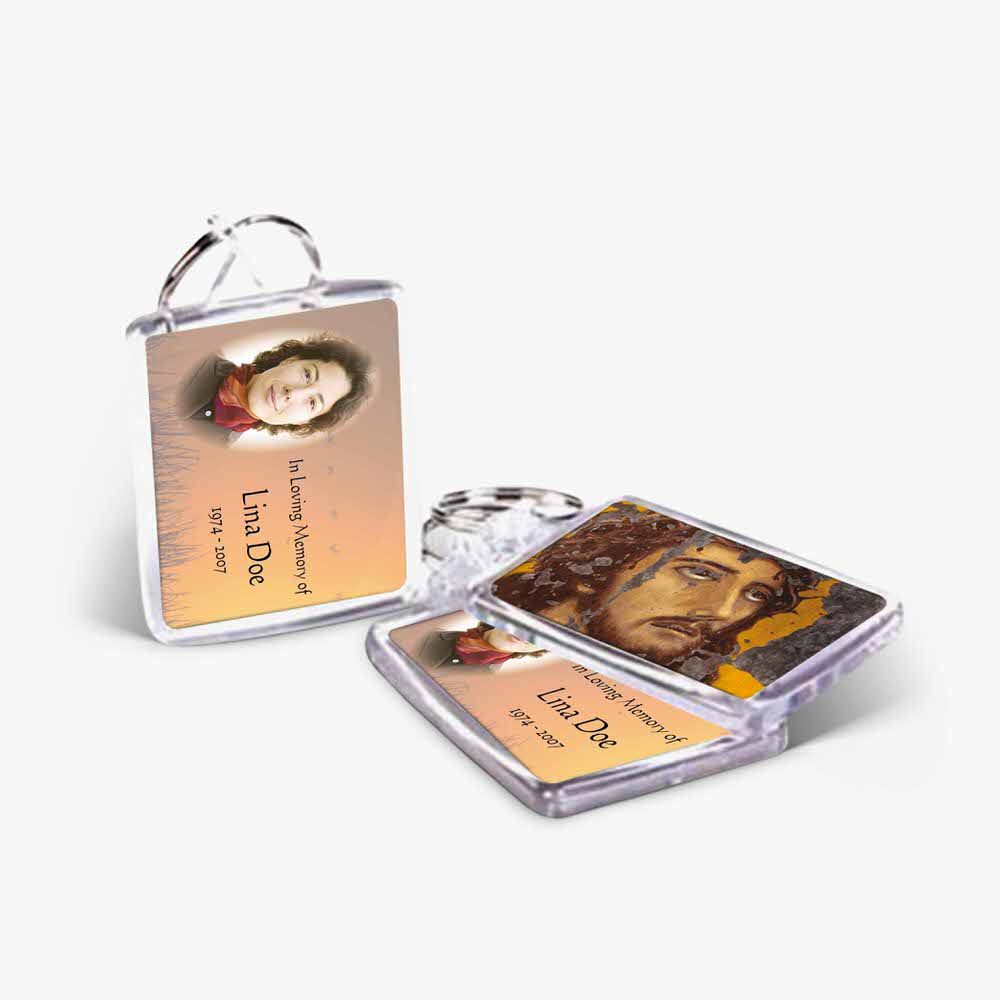 a key chain with a picture of jesus on it