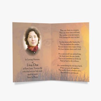 a funeral prayer card with a photo of a woman in a field