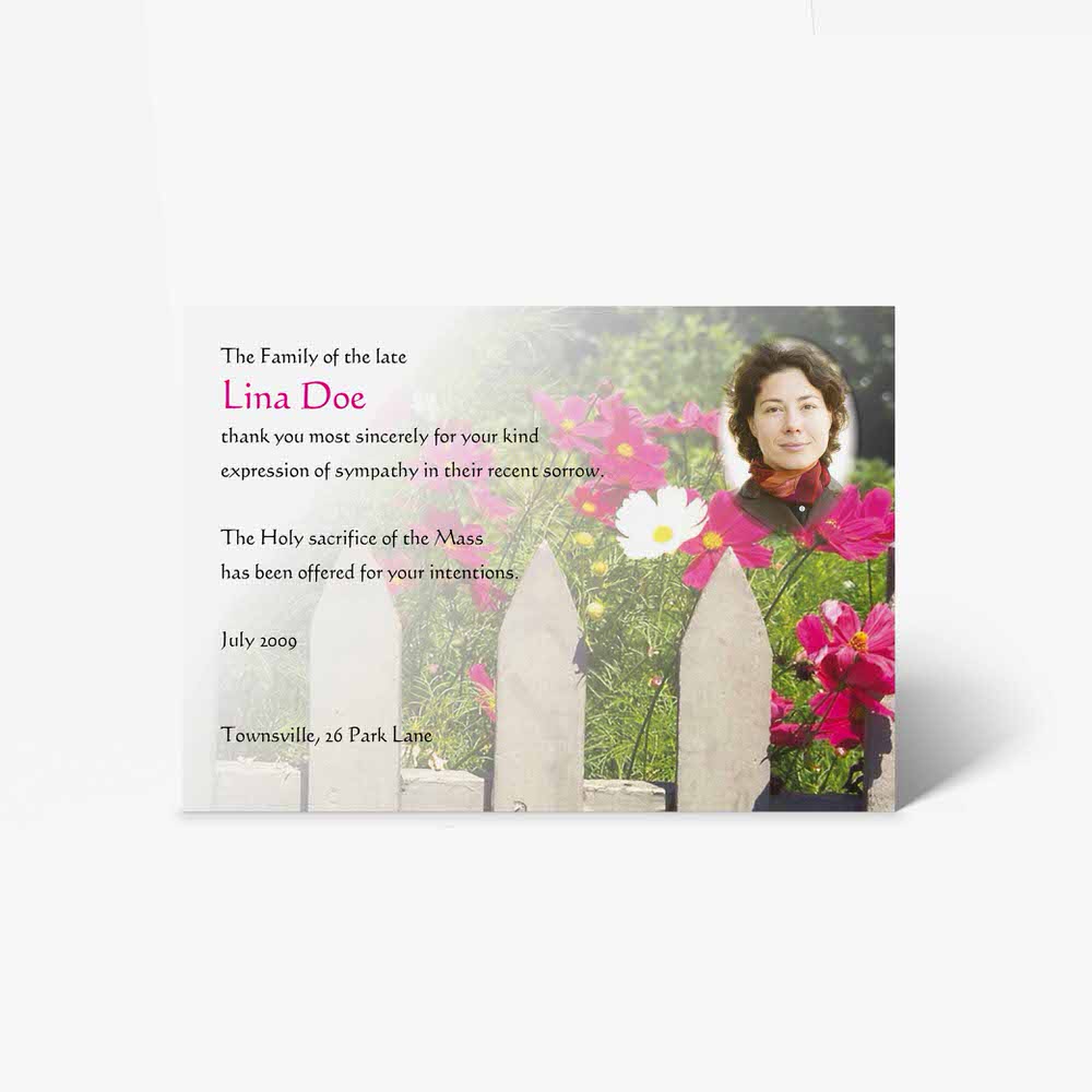 a card with a photo of a woman in a garden with flowers